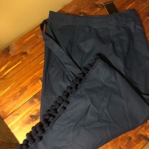 Blue skirt with pom poms